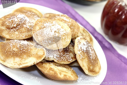 Image of Poffertjes with powdered sugar and jelly