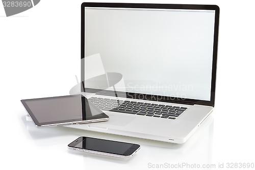 Image of modern computer devices - laptop, tablet and phone