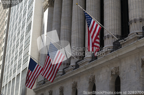 Image of American flags and stock exchange