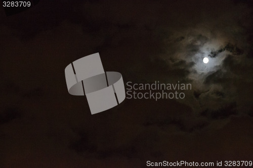 Image of Moon between clouds