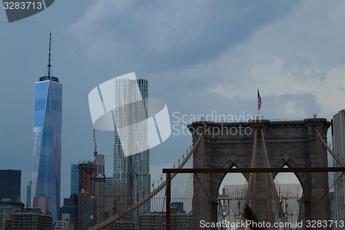 Image of Crossing the bBrooklyn bridge before a storm