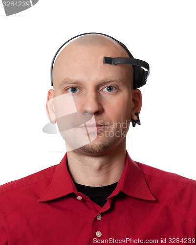 Image of Portrait of young man with EEG (electroencephalography) headset 