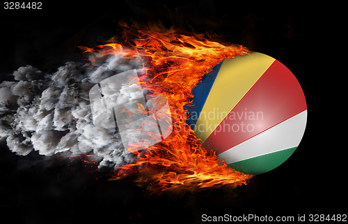 Image of Flag with a trail of fire and smoke - Seychelles