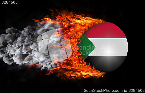 Image of Flag with a trail of fire and smoke - Sudan