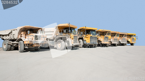 Image of dirty haul trucks