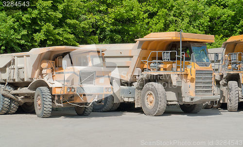 Image of dirty haul trucks