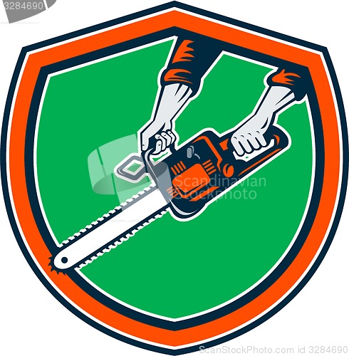 Image of Hand Holding Chainsaw Shield Retro