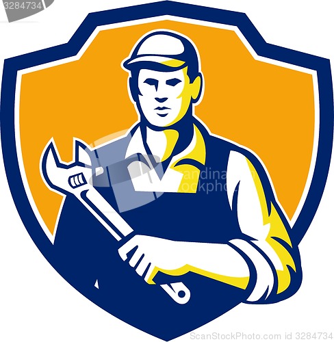 Image of Mechanic Holding Adjustable Wrench Shield Retro