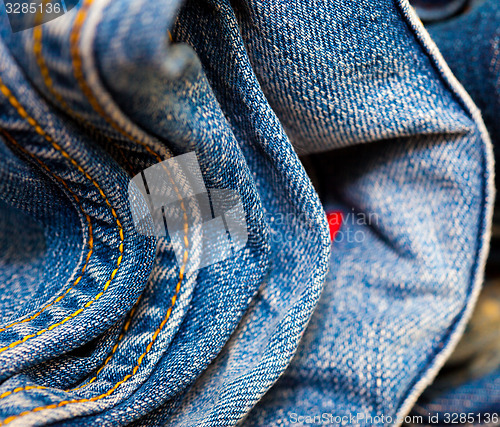 Image of stitching on blue jeans