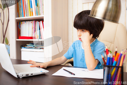 Image of boy doing homework