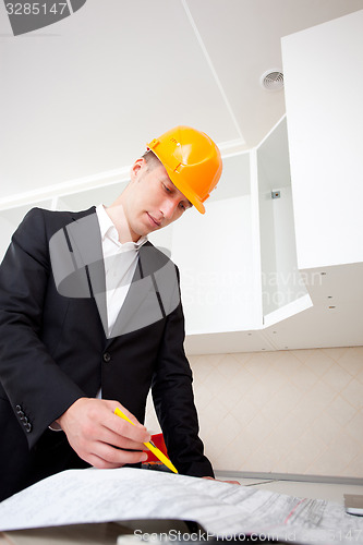 Image of engineer working with documents