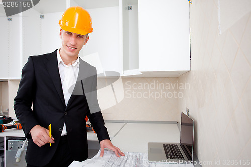 Image of engineer with blueprints