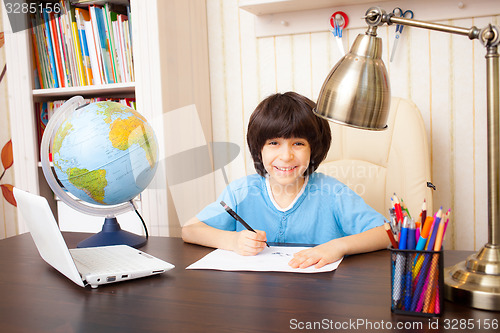 Image of schoolboy doing homework