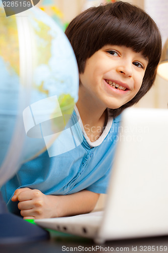 Image of boy on a geography lesson