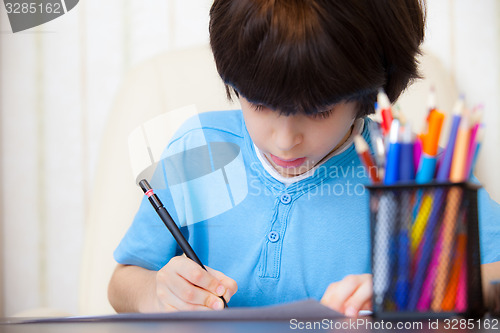 Image of Boy doing homework