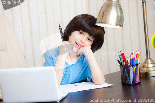 Image of schoolboy doing homework