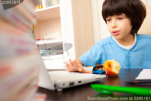 Image of student works on a computer