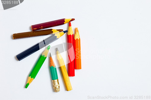 Image of several vintage pencils on a white