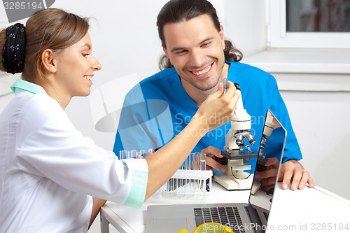 Image of Doctor shows test tube
