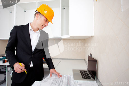 Image of civil engineer working with documents