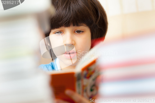 Image of child reading a book