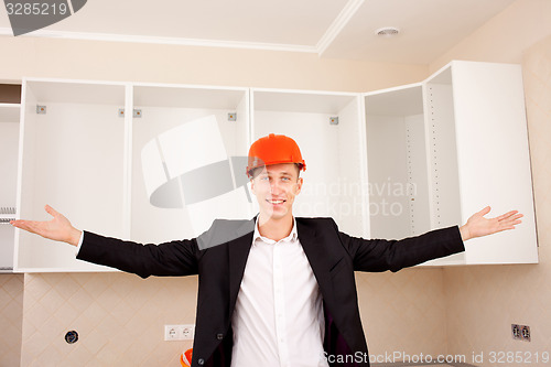 Image of smiling foreman shows interior