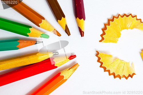 Image of set of a old colored pencils with shavings