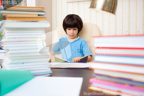 Image of boy reading a book