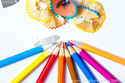 Image of pencils and shavings on white background