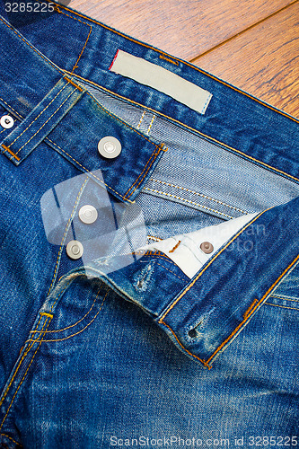 Image of unbuttoned jeans