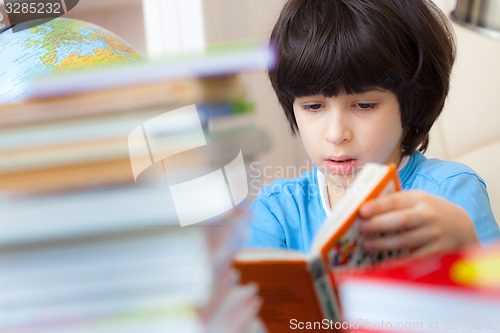 Image of boy reading a book