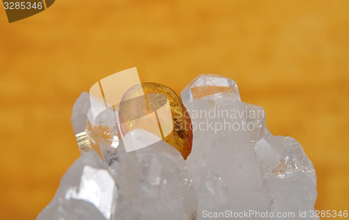 Image of Amber on rock crystal