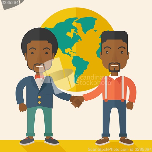 Image of Two black guys happily handshaking.