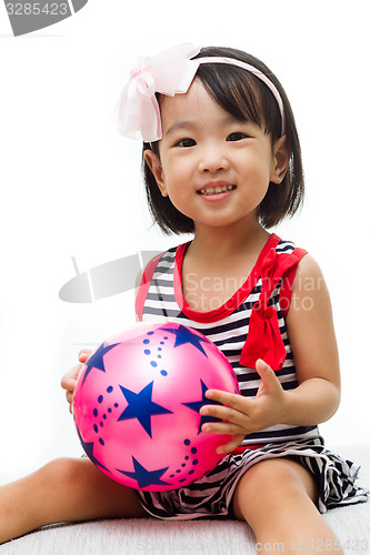 Image of Asian Chinese Girl Holding Ball