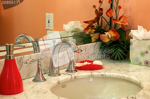 Image of orange bathroom sink