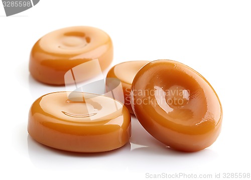 Image of caramel candies isolated on white background