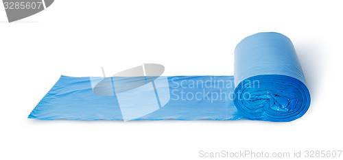 Image of Roll of blue plastic garbage bags in front view