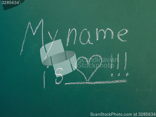 Image of My name is love, written in white chalk on green chalkboard