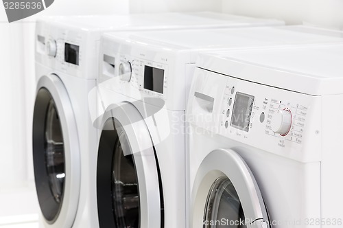 Image of line of laundry machines