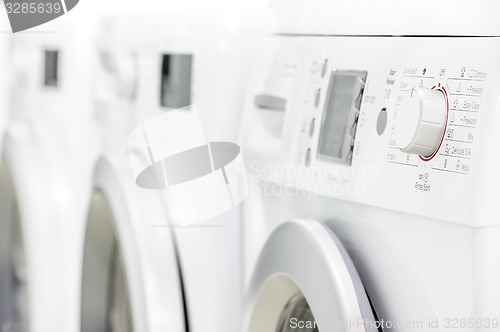 Image of line of laundry machines