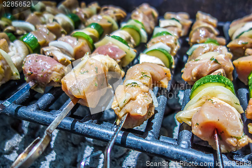 Image of shish kebab on skewers on a grill on a holiday