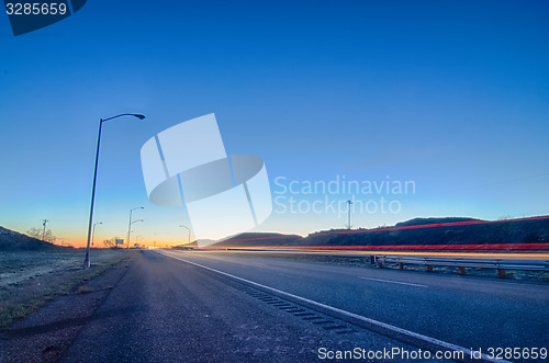 Image of early orning travel on highway before sunrise