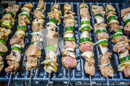 Image of shish kebab on skewers on a grill on a holiday