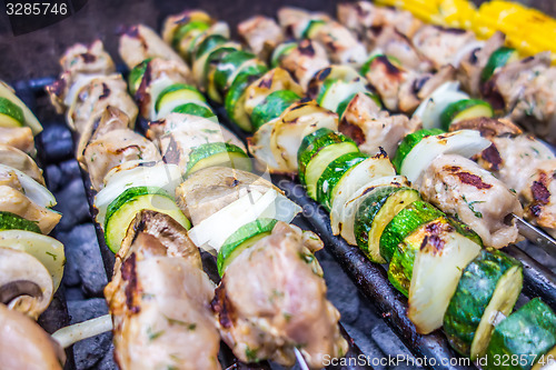 Image of steak shishkabob skewers with vegitables cooking on flaming gril