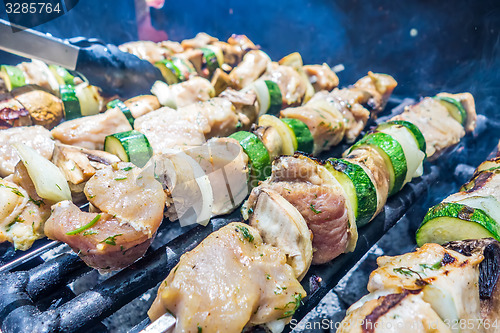 Image of steak shishkabob skewers with vegitables cooking on flaming gril