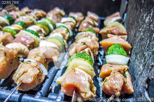 Image of shish kebab on skewers on a grill on a holiday