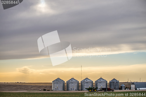 Image of spring farmland before sunset on a cloudy day