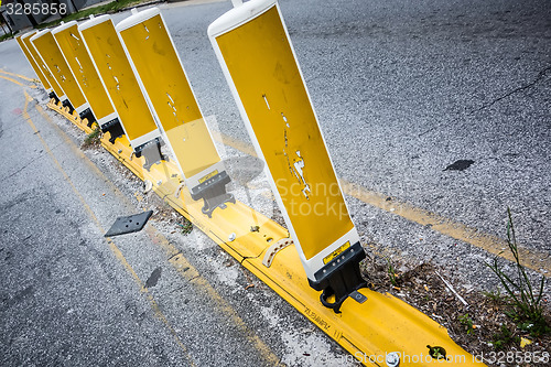 Image of yellow reflective cones set up to direct traffic