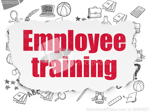 Image of Learning concept: Employee Training on Torn Paper background