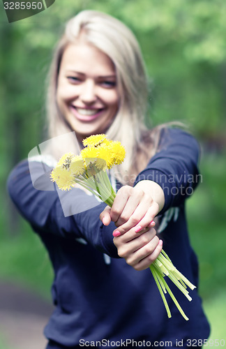 Image of woman with dandelions